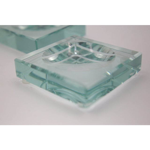 Wonderful pair of crystal ashtrays or pocket emptiers produced by Italian manufacture Fontana Arte in the 1960s. The...
