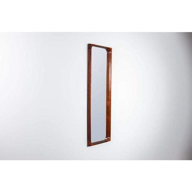 Beautiful high-quality wall mirror by niels clausen, produced by nc møbler in denmark in the 1960. It is a refined example...