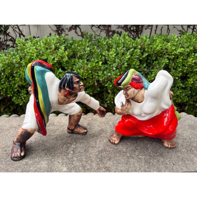 Pair Of Brayton Laguna Glazed Pottery Figures. Offered is a beautiful colorful pair of mid century figures or sculptures...