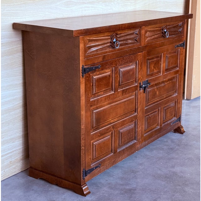 from Northern Spain, constructed of solid walnut, the rectangular top with molded edge atop a conforming case housing two...
