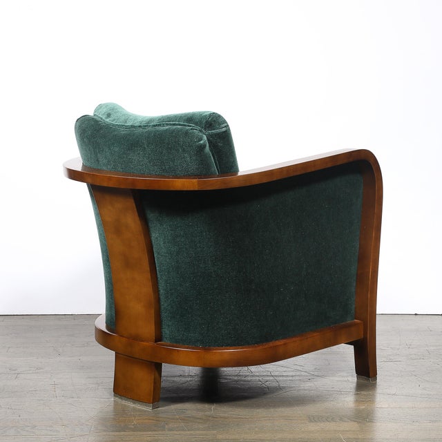 This elegant Pair of Art Deco Curved Walnut Armchairs in Eucalyptus Velvet w/ polished Nickel Sabots originated in the...