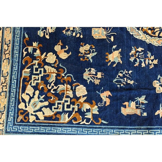 Antique Chinese - Peking Chinese Floral, Medallion Blue 1890s Rug, Circa Date: 1890s. This exquisite example of late Qing...