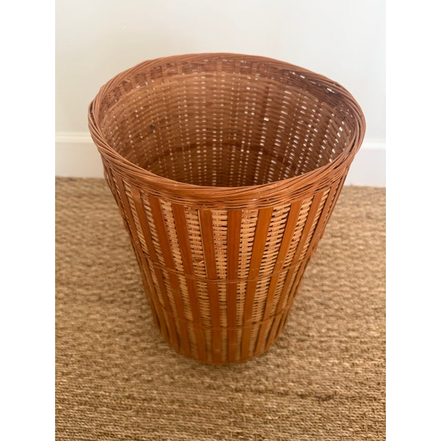 Woven rattan umbrella stand. Fine woven body with tortoise rattan sides. Holds large golf umbrellas as pictured.