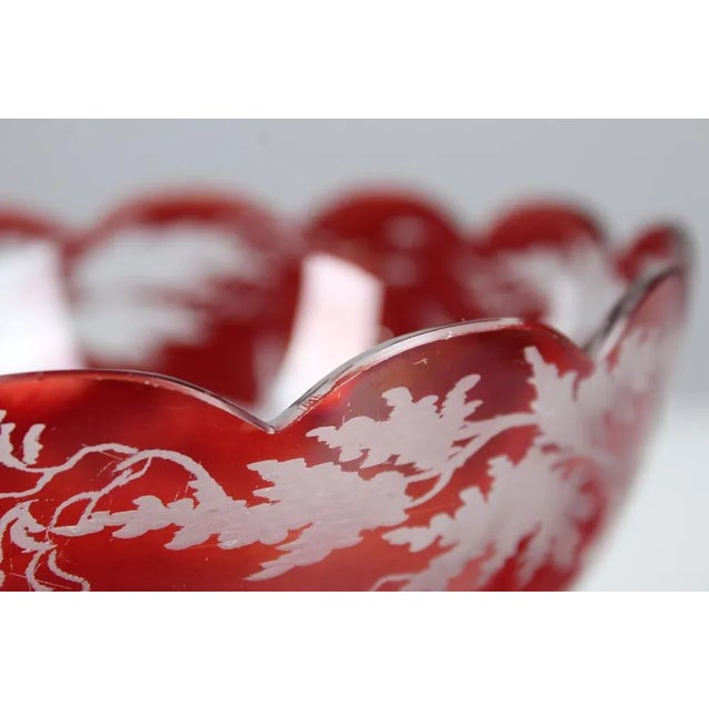 Beautiful glass set made of Bohemian glass. The set consists of a large ruby serving bowl, a small ruby glass and a small...