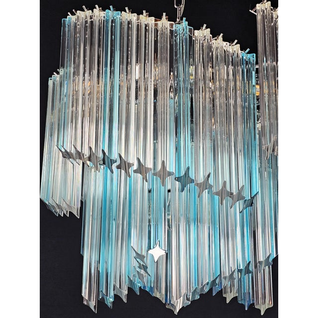 Delightful Vintage Murano chandelier, Venini style. This lamp has a particular shape that recalls ancient woven fans. with...