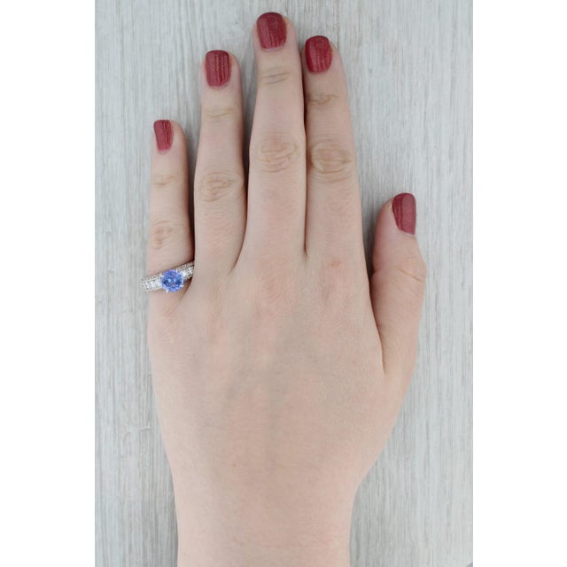 Gemstone Information: - Natural Tanzanite - Carats - 1.94ct (8 mm) Cut - Round Brilliant Color - Purple Treatment - Heated...