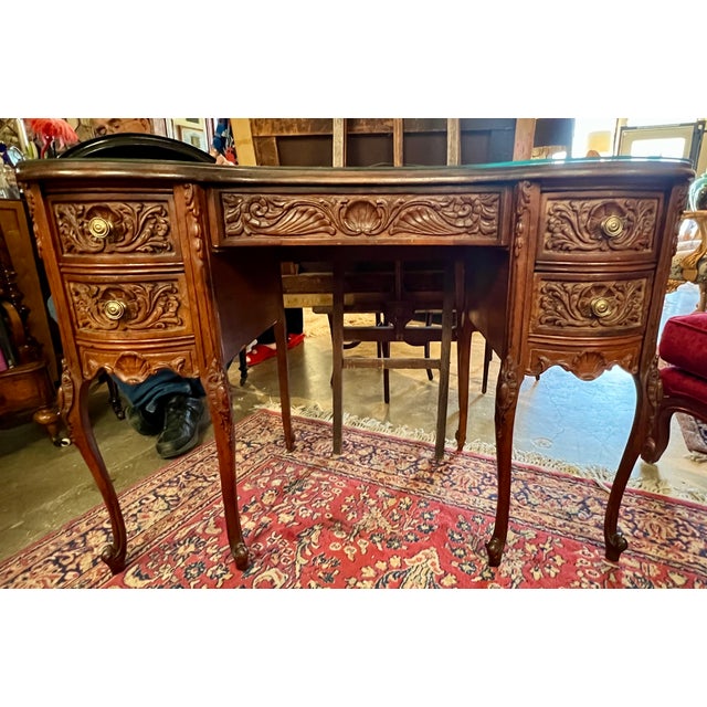Gorgeous vintage French-style kidney-shaped desk featuring 2 drawers on each side and one main drawer. Crafted of walnut...