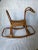 Large rattan rocking horse with a caned seat. A whimsical addition to any nursery!
