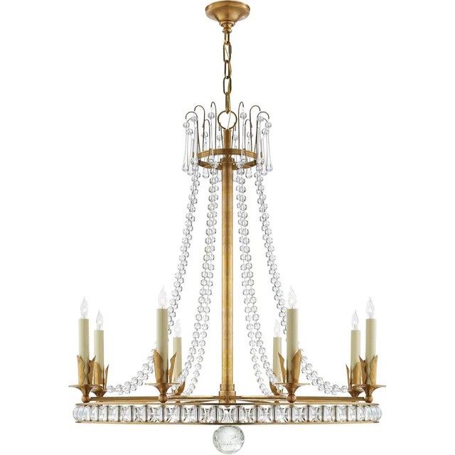 Regency Large Chandelier in Hand-Rubbed Antique Brass with Seeded Glass Designer: Joe Nye Fixture Height: 33.5" Canopy:...