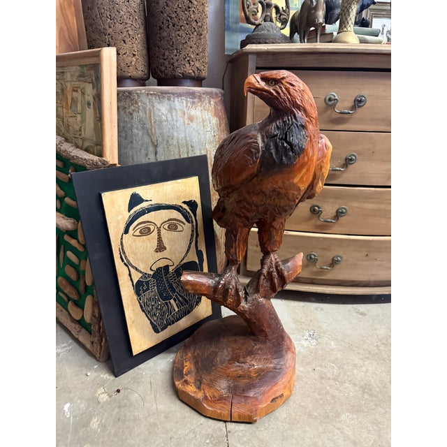 Very large hand carved eagle. It is a nod to sweeter times. Sculpted from a huge cedar log. This piece originated...