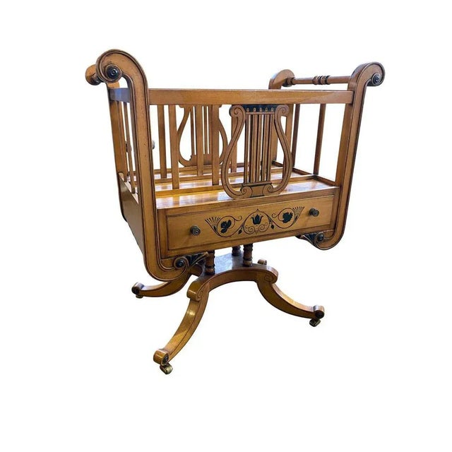 A beautifully designed satinwood newspaper stand/magazine rack. Neoclassical english sheraton styled, this piece is...