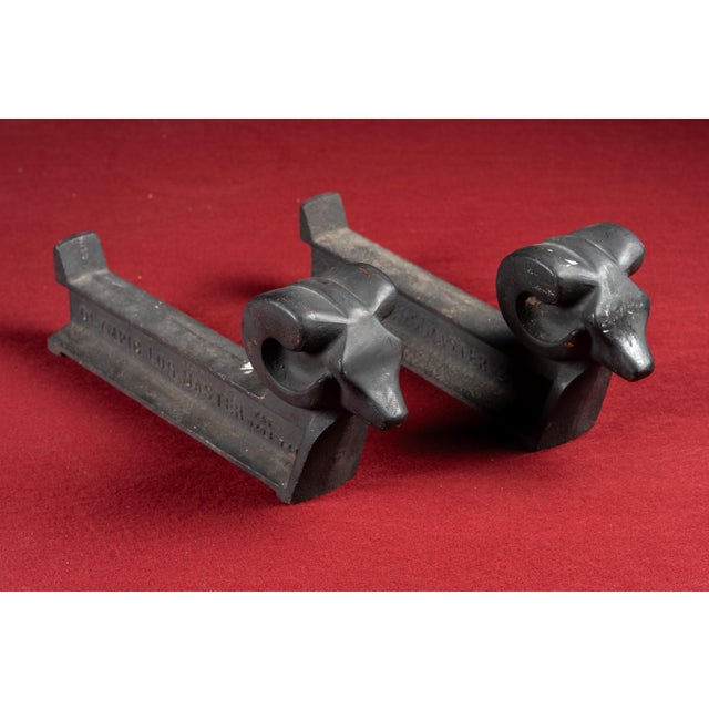 c. 1900s-1910s; Olympic Logmaster - Chicago, IL Pair of cast iron andirons with stylized ram's head finials, marked...