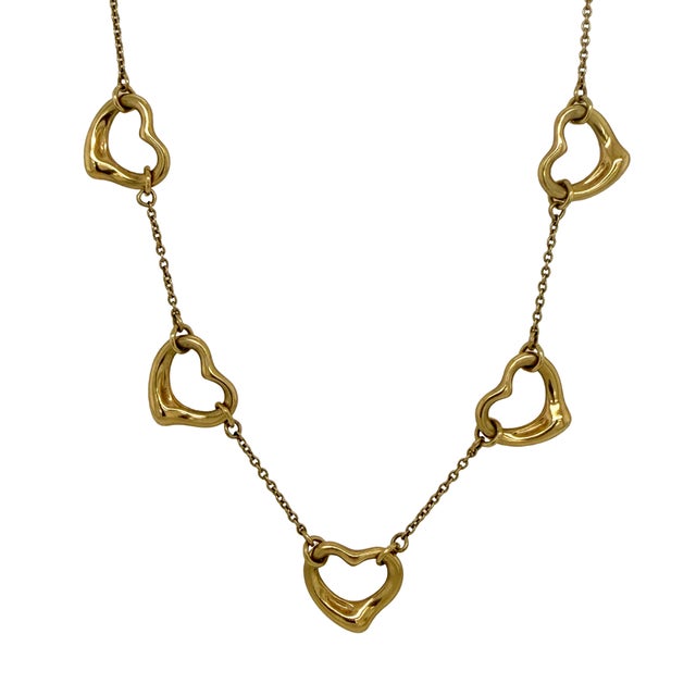 This vintage Elsa Peretti Tiffany & Co. necklace showcases her iconic Open Heart motif, rendered in sculptural 18K gold...