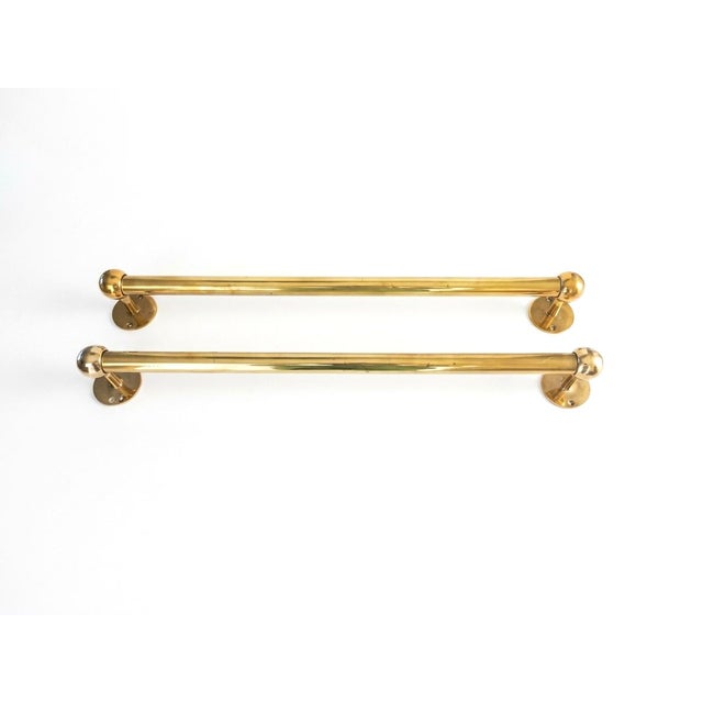 This exceptional pair of vintage solid brass towel bars offers the perfect blend of architectural substance and timeless...