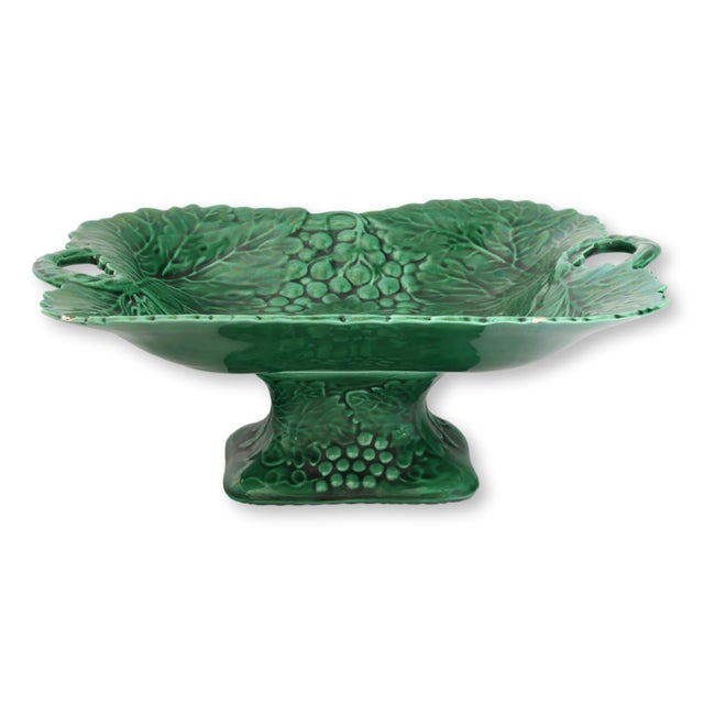 Late 19th to early 20th century English majolica compote featuring a raised, footed form richly modeled with grape...