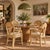 Beautiful set of four vintage coastal dining armchairs crafted from sculptural rattan with decorative leather-wrapped...