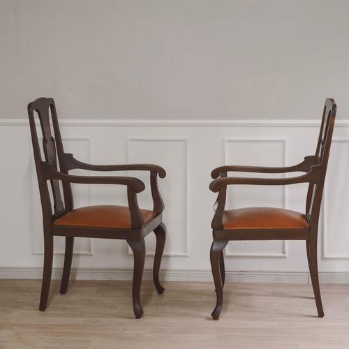 This pair of armchairs is stylistically related to the late Baroque or Baroque-inspired forms of around 1900, as were...