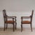 This pair of armchairs is stylistically related to the late Baroque or Baroque-inspired forms of around 1900, as were...