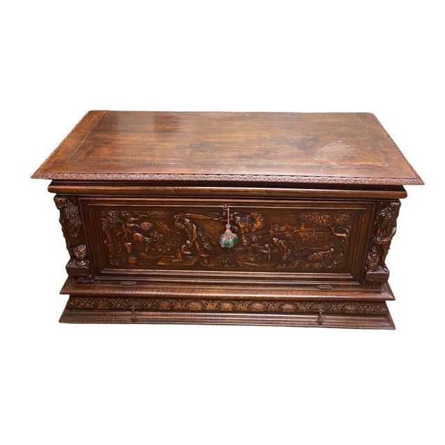 An impressive Italian Renaissance Revival walnut buffet or trunk dating to circa 1830 Crafted in richly figured walnut,...