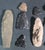 Curated Collection of Hand-Worked Stone Lithic Artifacts and Projectile Points - 21 Pieces This expansive and diverse...