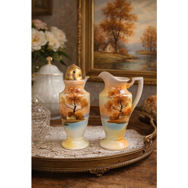 This elegant vintage berry sugar shaker and creamer set by Noritake features the charming “Tree in the Meadow” design, a...