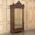 19th Century French Louis XVI Walnut Armoire rises a majestic 101 inches and is topped with an incredibly sculpted crown...