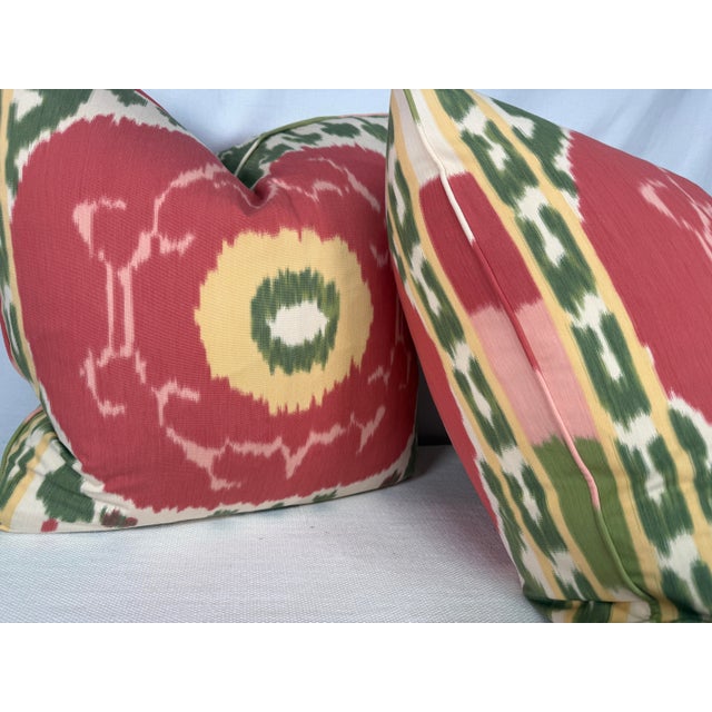 Custom pair of 22" pillows covered in Schumacher "Samarkand Ikat" in color watermelon. These pillows have tapered corners...