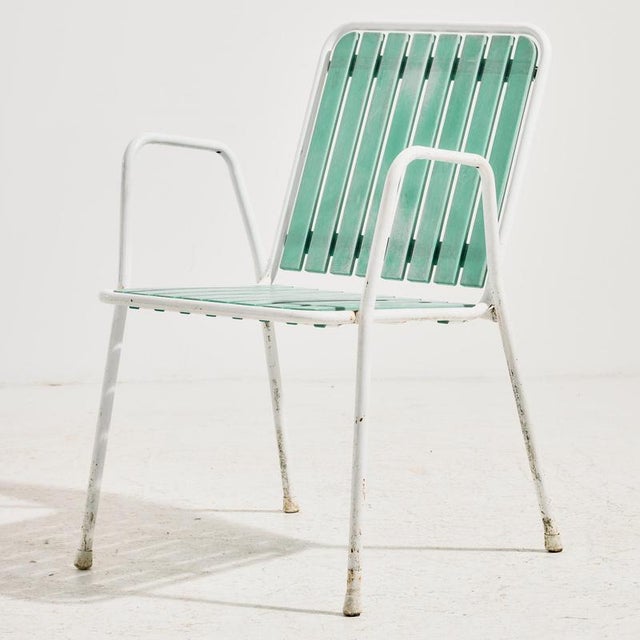 Austrian stackable garden armchair by Karasek on tubular metal frame with plastic seat and backrest from the 1980s. with...