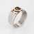Out of production vintage Cartier ring crafted in sterling silver & 18k yellow gold (circa 1970s). The Cartier "CC" logo...