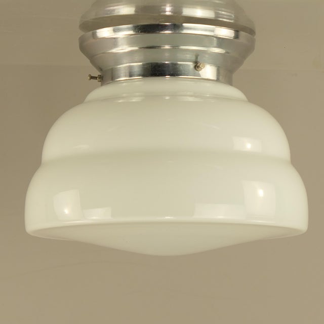 Chrome-plated brass and hand-blown overlaid glass. 1xE27 Up to 250V (Europe/UK Standard).The wiring of this item may be...