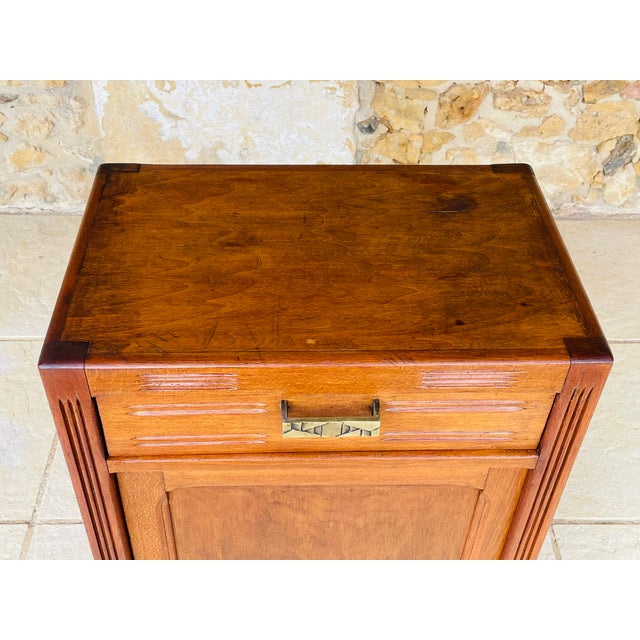 Art deco, storage cabinet circa 1930s/1940s piece is made of wood with a walnut color finish. there is a clean and fully...
