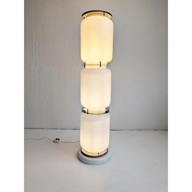 Space Age sculptural floor lamp consisting of 3 individual glass modules, held together by metal rings,by Enrico Tronconi....