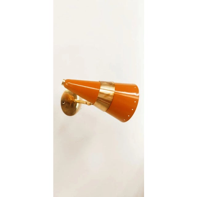 Orange & Gold Adjustable Cone Sconce, in Very Good conditions. Designed 1970 to 1979 Up to 250V (Europe/UK Standard).The...