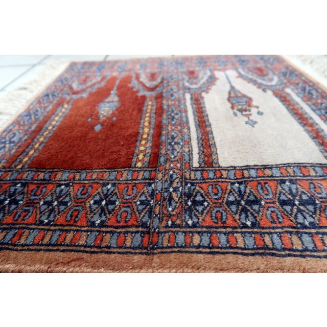 Handmade Vintage Pakistani Lahore Prayer Rug: Indulge in the intricate craftsmanship of our Handmade Vintage Pakistani...