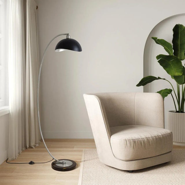 Indulge in the captivating allure of mid-century modern design with the Luna Bella Chairside Arc Floor Lamp by NOVA of...