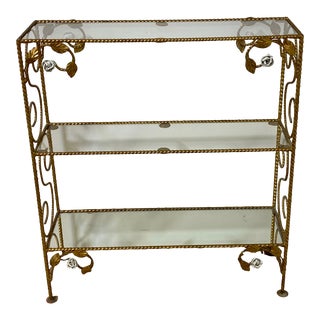 Mid 20th Century Italian Gold Metal Curio Shelf Bookcase With One Mirrored and Two Clear Glass Shelves and White Floral Roses Accents For Sale