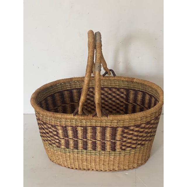 French antique woven market basket with distressed handle., for storage.