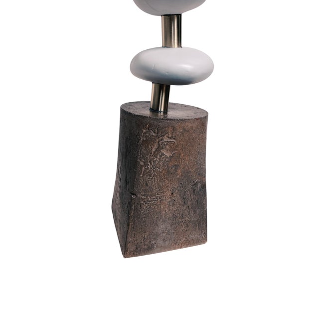 Unique use of beach stone , brass and paint combined to create this stunning table sculpture. The base is made of...