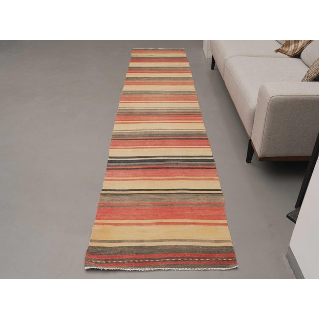 Vintage Hand-Knotted area rug is a semi-antique vintage area rug. The '70s Eastern region of Anatolia's unique rug is...