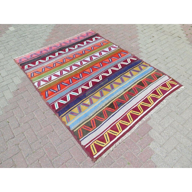 This beautiful, traditional vintage, hand knotted Turkish area rug is approximately 60 years old. It is handmade of very...
