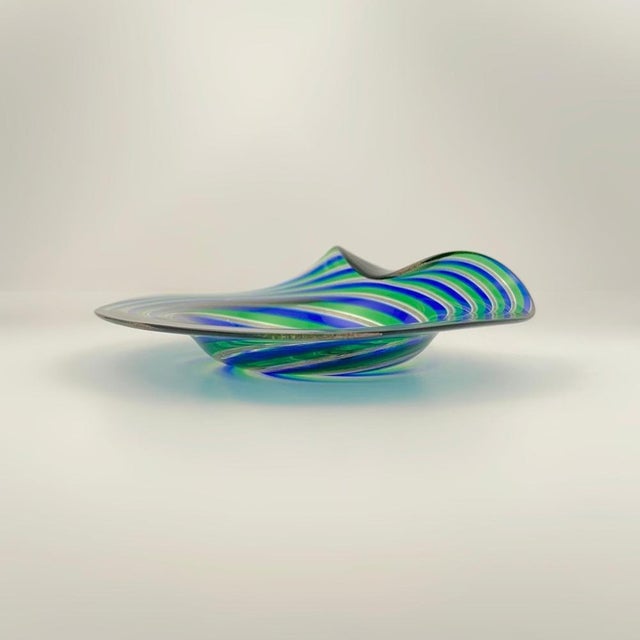 A vibrant Murano filigrana glass dish, attributed to Cenedese & Alberelli, Italy, circa 1970s. This small decorative dish...