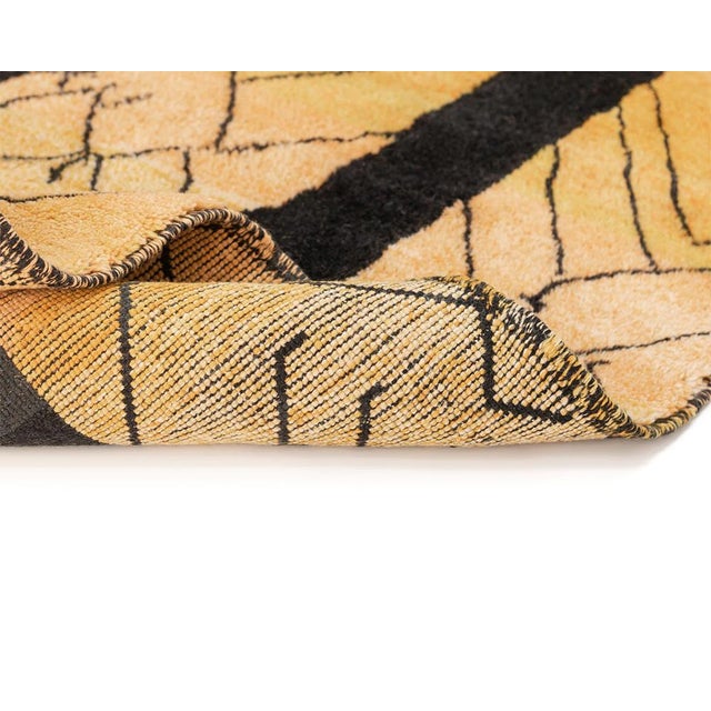 Striking hand-knotted wool rug featuring a captivating abstract design with a vibrant palette of Gold Ochre, Blue,...