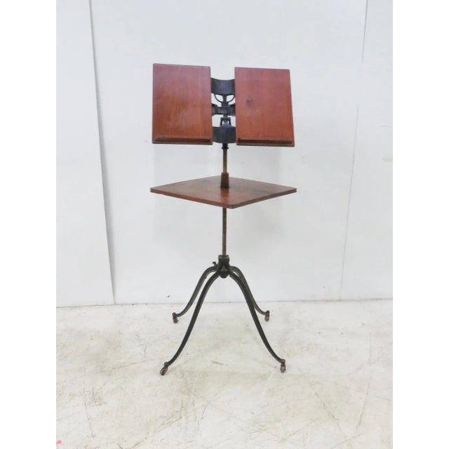 iron base and brackets, walut book holder and shelf , adjustable from 41” tall to 49” tall .