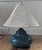 Hampshire ceramic lamp with a globed form and matte green glaze. Metal details and acorn finial. Shade not included;...