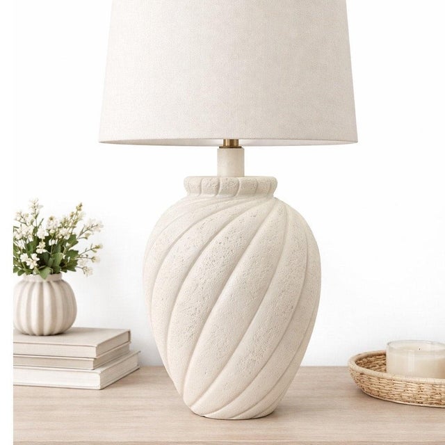 This vintage white plaster table lamp features a sculptural swirl design with a textured finish that embodies iconic...