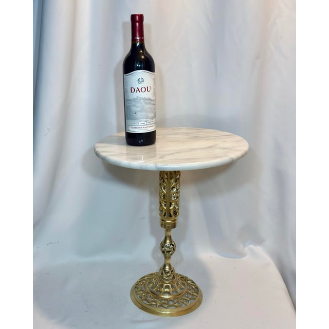 Bring a touch of Golden Age glamour to your interior with this elegant Hollywood Regency drinks table. Perfectly scaled...