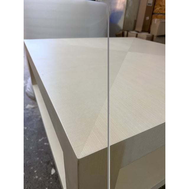 Handcrafted, beefy-leg coffee table. Made in the USA. Wrapped in an off-white Grasscloth textured material. Clear-coat...