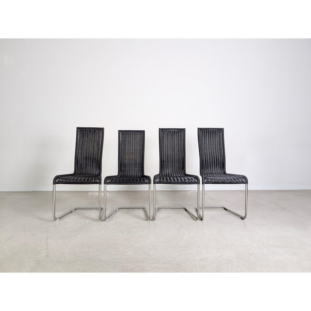 Beautiful set of four Tecta B20 cantilever chairs in a modern black finish for sale. Designed by Jean Prouvé, these chairs...