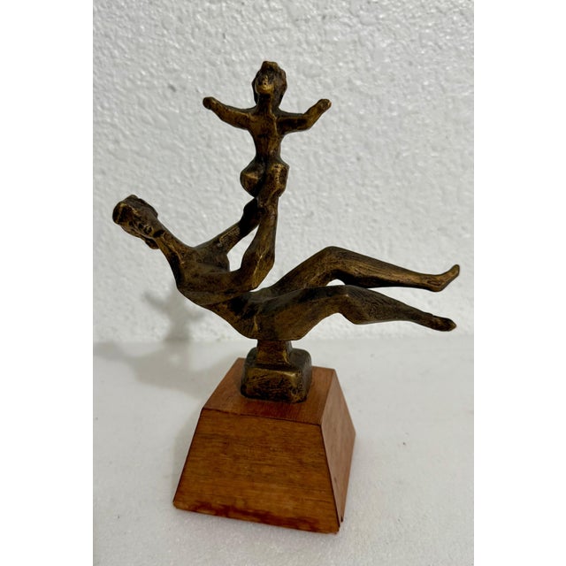 Chaim Gross (American, 1904-1991) Cast bronze sculpture Caring (or Mother and Child) signed Mounted on wooden plinth...