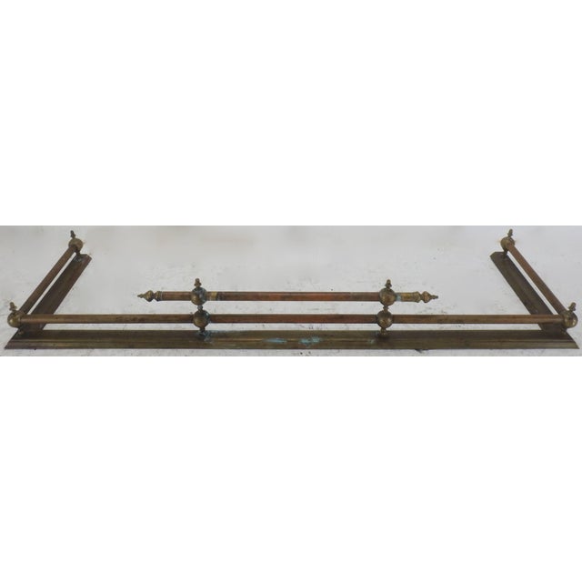 The aged patina on this Classic fireplace fender will give your cozy spot a new look! Brass spheres topped with finials...